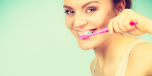 woman brushing her teeth