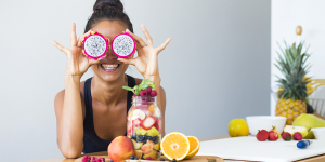 woman smiling holding fruit